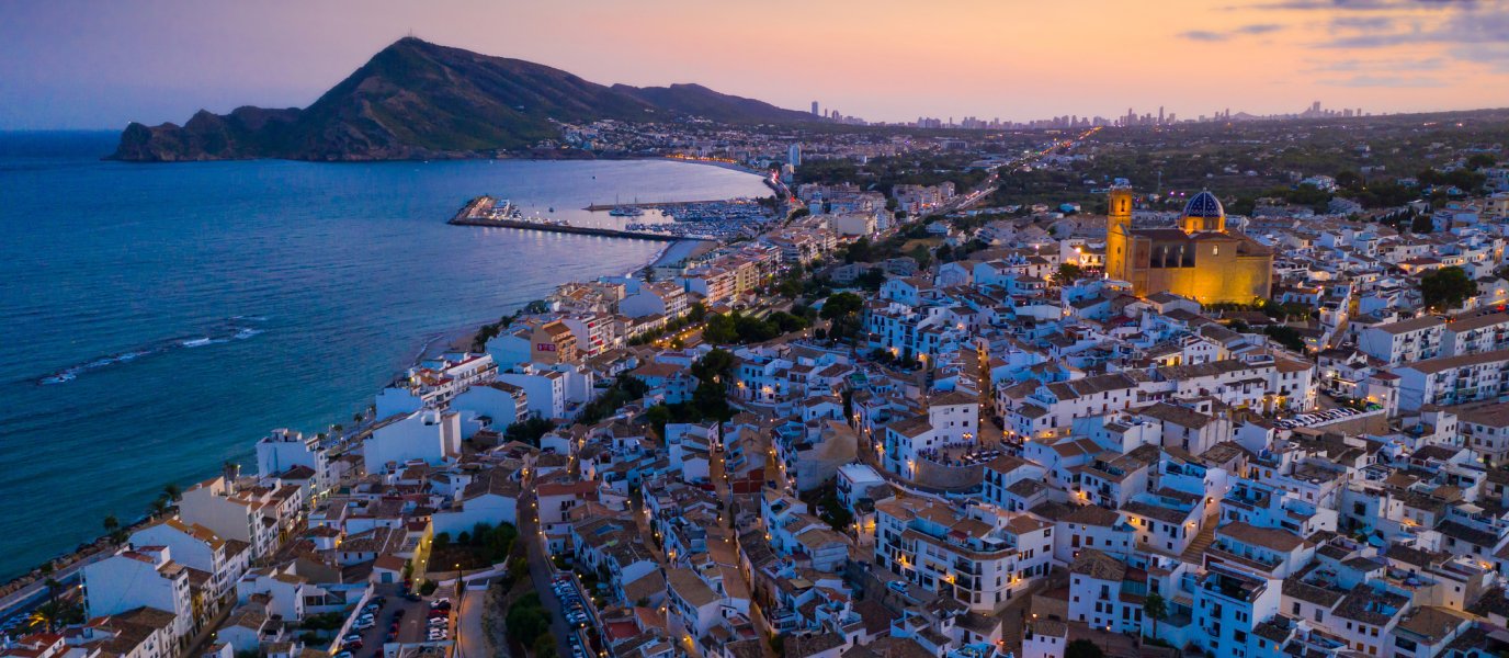 Altea at dusk with illuminated harbour