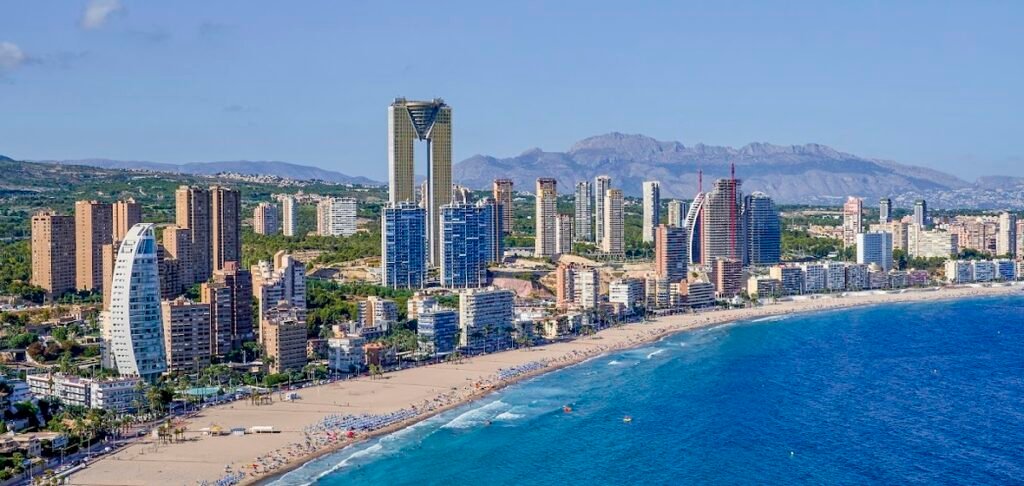 Spain property market 2026 — aerial view of Benidorm and Costa Blanca coastline
