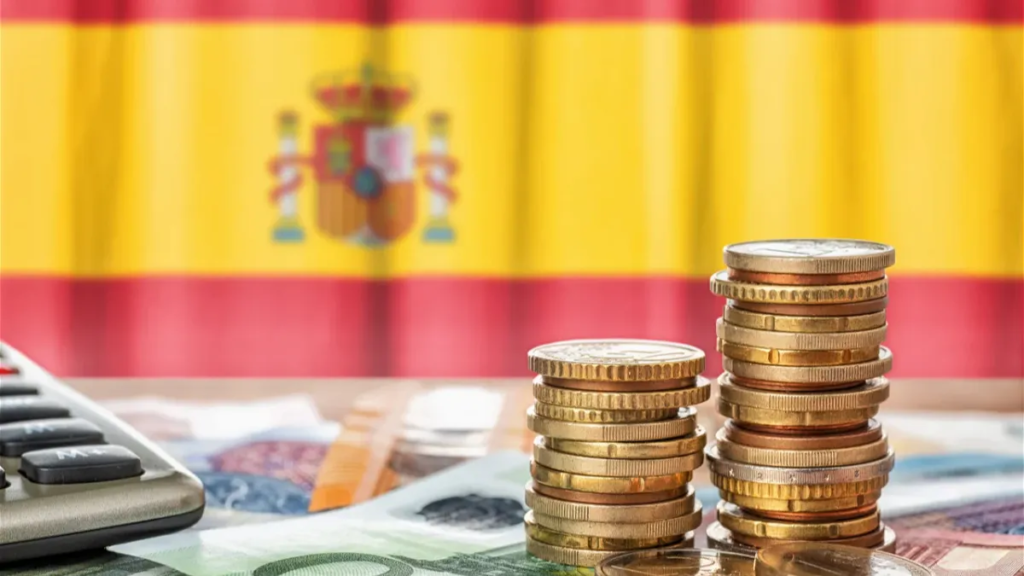 Selling property Spain tax guide 2026 — Spanish flag with euro coins and calculator representing property sale taxes