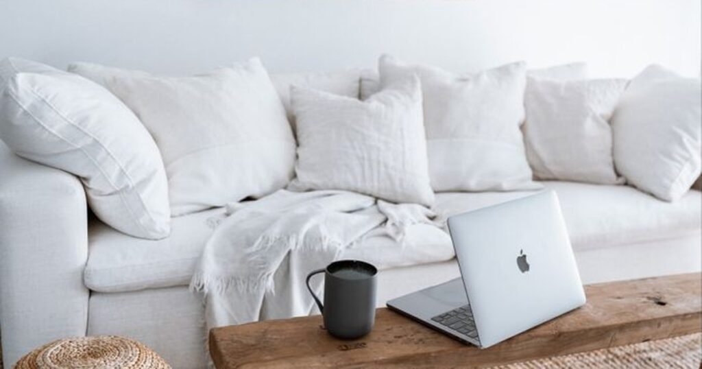 Empadronamiento Spain - laptop and coffee on a table, checking who is registered at a property
